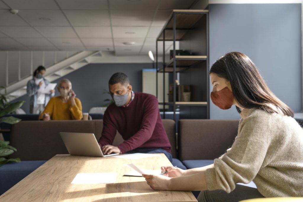 Employees working with masks